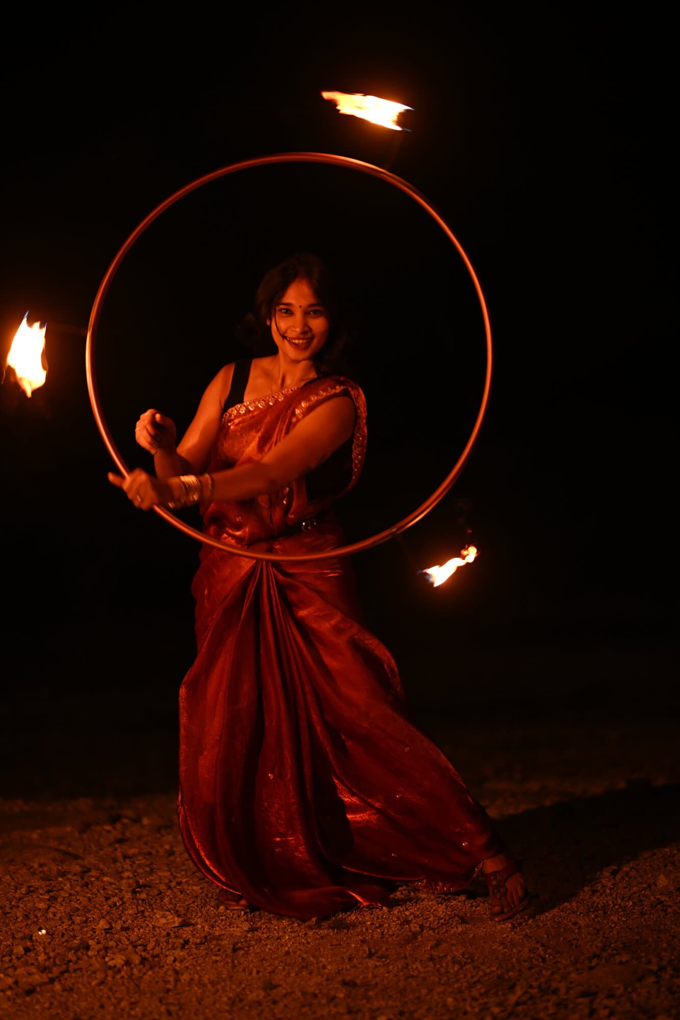 Devina performing a fire hoop routine