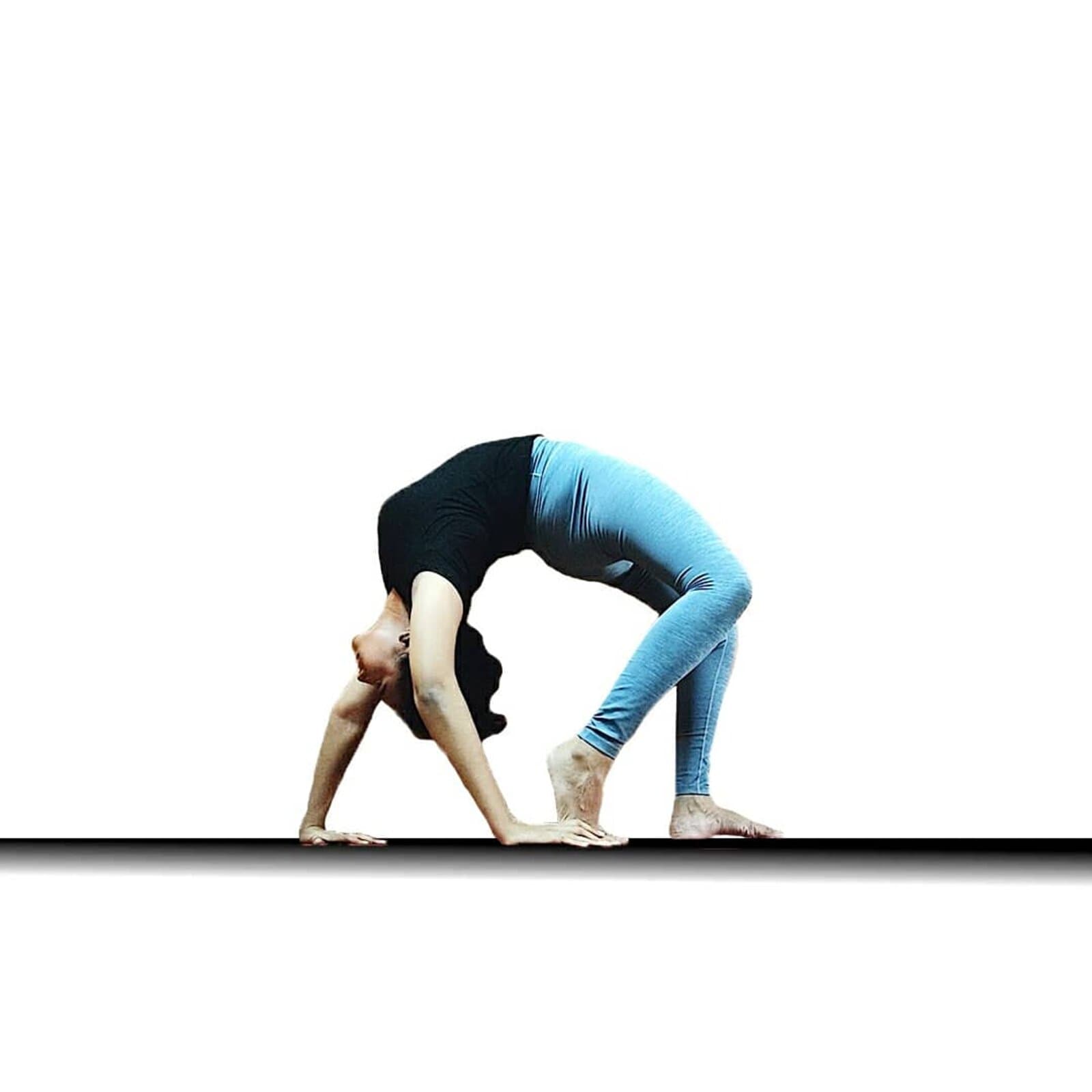 Devina in a yoga backbend, taught live in group batches